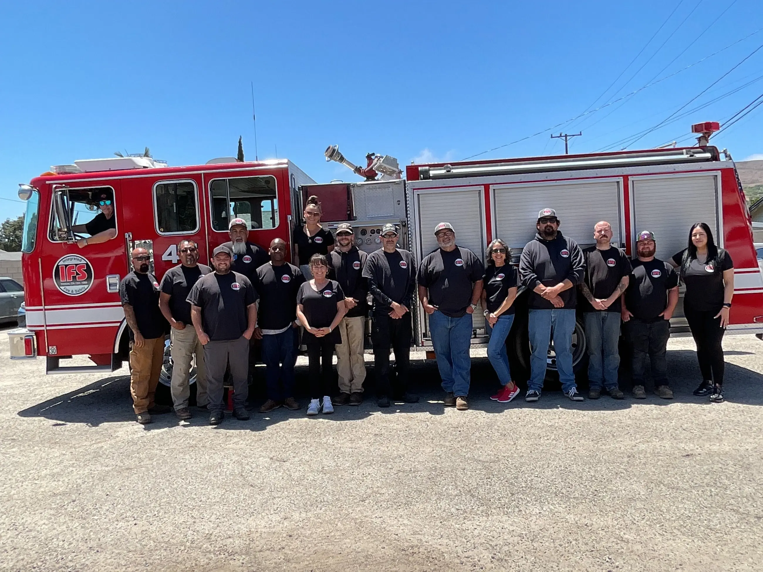 The Integrated Fire & Safety team in front of an IFS fire engine at the Ventura shop